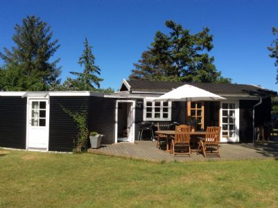 Nice Lovely summercottage made of wood standing on a natureground nearby beach and forest. .